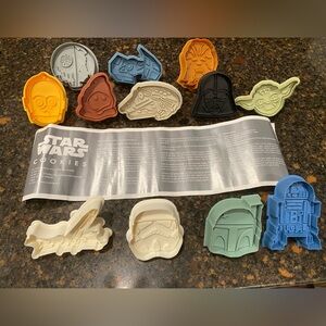 12 pieces Williams Sonoma Star Wars cookie press cutters.
